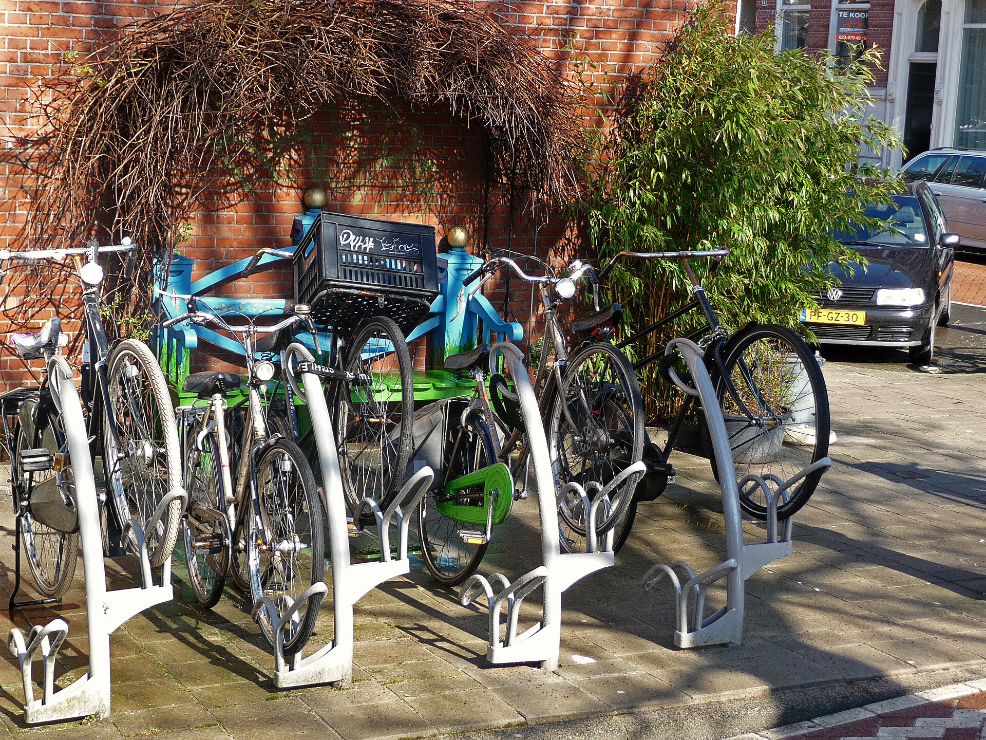 Bicycles parked in a rack on an Amsterdam street